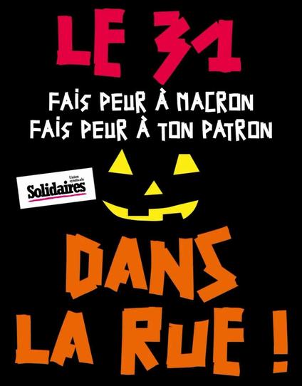 Il y a ecrit : le 31 fais peur à Macron, fais peur a ton patron. Dans la rue ! Syndicat Solidaires. 
Au milieu on a en jaune les yeux, le nez et la bouche d'une citrouille d'halloween